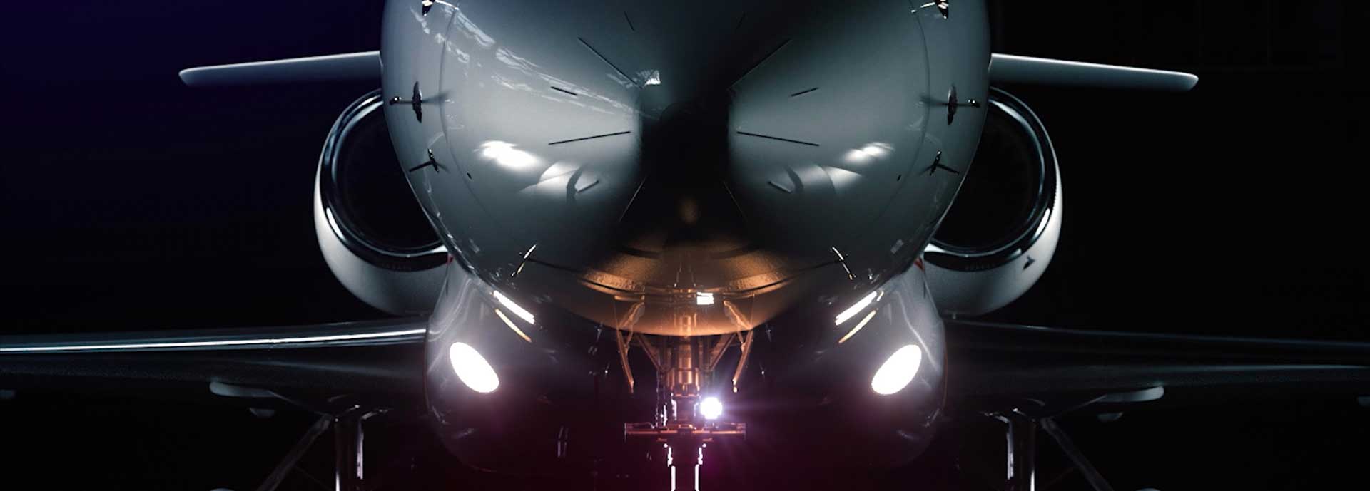 Falcon 900 with landing and taxi lights illuminated